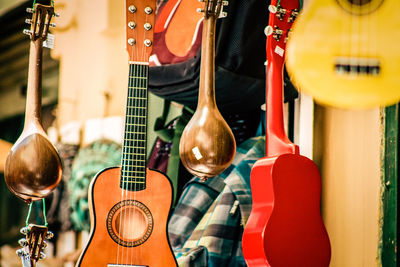 Close-up of guitars for sale