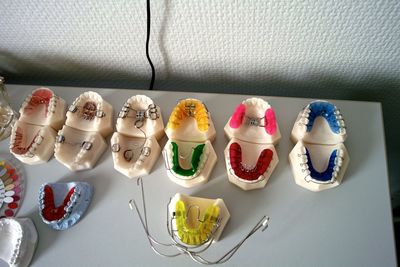 High angle view of multi colored dental equipment on table