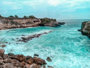 Scenic view of sea shore against sky