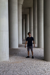 Full length of man standing on colonnade