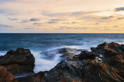 Scenic view of sea against sky during sunset