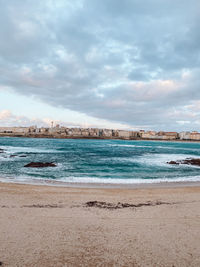 Scenic view of beach against sky