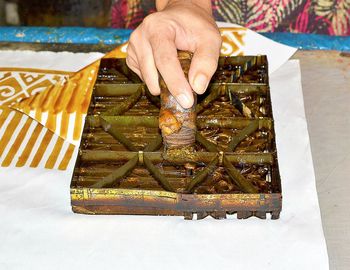 High angle view of person holding food on table