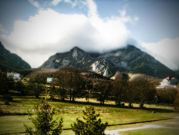 Scenic view of landscape against cloudy sky