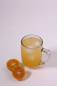 Orange tea against white background