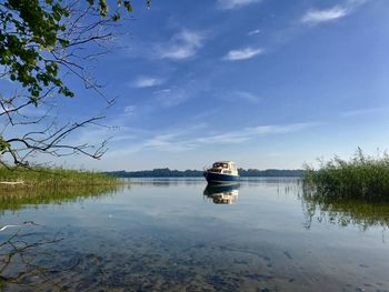 Boat in lake against sky