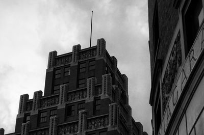 Low angle view of apartment building against sky