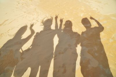 Shadow of people on the beach