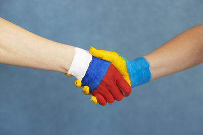 Cropped hand of man with nail polish