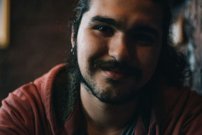 Close-up portrait of smiling young man