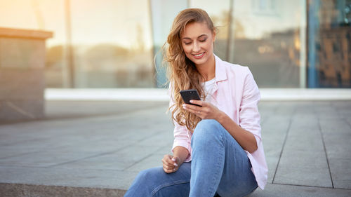 Mid adult man using mobile phone