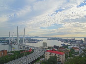 High angle view of city street and buildings against sky