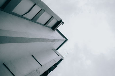 Low angle view of airplane flying against sky