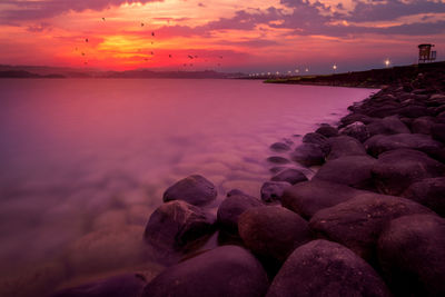 Scenic view of sea against sky during sunset