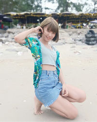 Full length of a smiling girl on beach