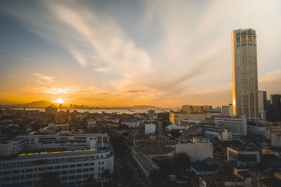 High angle view of buildings against sky during sunset