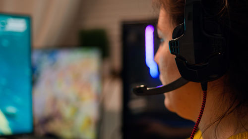 Close-up of woman wearing headphones