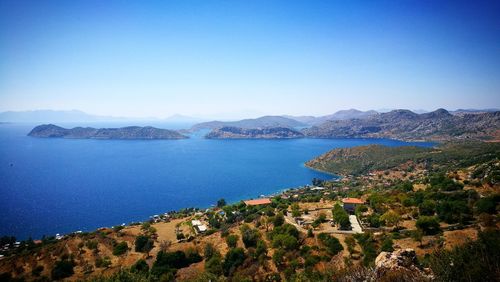 Scenic view of sea against blue sky