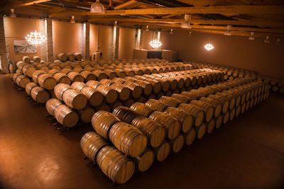 Row of illuminated lighting equipment on table in building