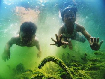 People swimming in sea