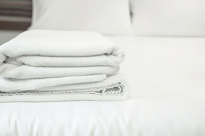Towels arranged on bed at home