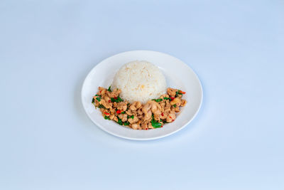 Directly above shot of food in bowl on blue background