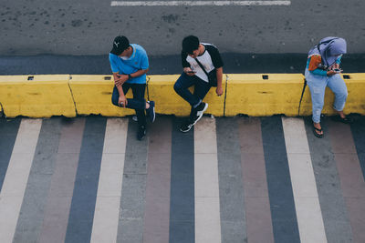 Men on zebra crossing