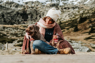 Midsection of women sitting outdoors