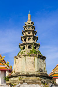 Low angle view of historical building against blue sky