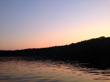 View of calm lake at sunset