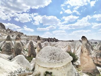 Panoramic view of rock formations against sky