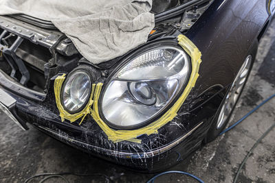 Close-up of car on road