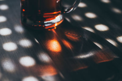 Close-up of wine glasses on table