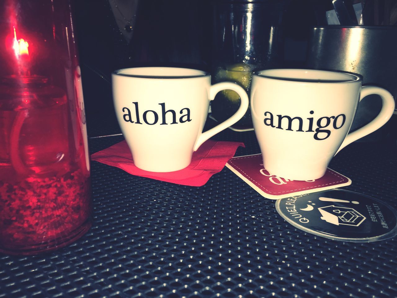 drink, indoors, food and drink, table, still life, text, refreshment, western script, coffee cup, coffee - drink, communication, close-up, freshness, cup, no people, drinking glass, coffee, saucer, high angle view, cafe