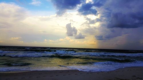 Scenic view of sea against sky at sunset