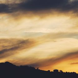 Scenic view of silhouette landscape against sky during sunset