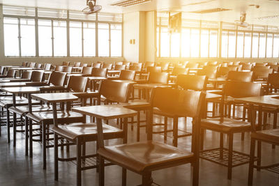 Empty chairs and table in restaurant