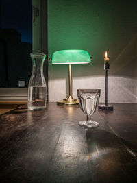 Illuminated lamp on table in restaurant
