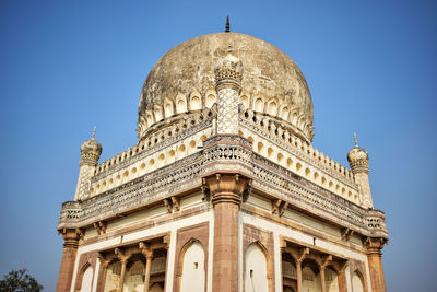 Low angle view of historical building against blue sky