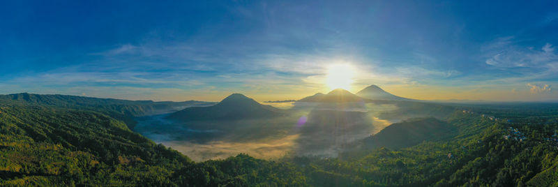 Scenic view of mountains against sky during sunset