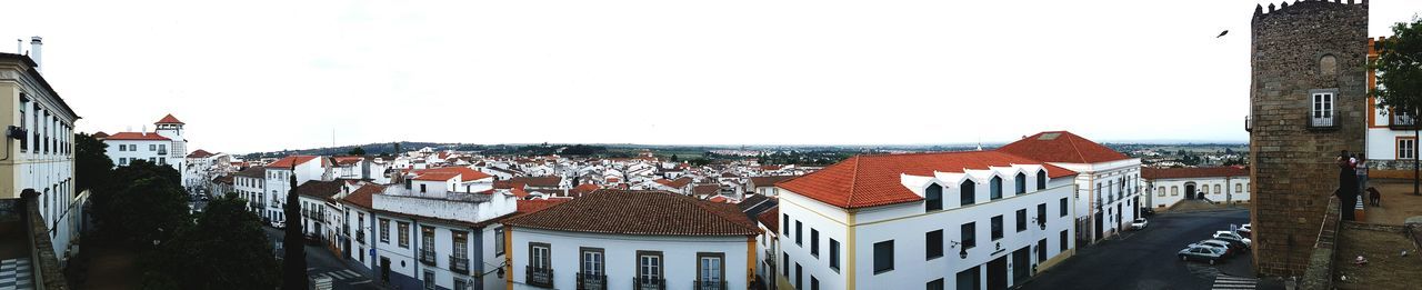 Panoramic view of buildings against clear sky