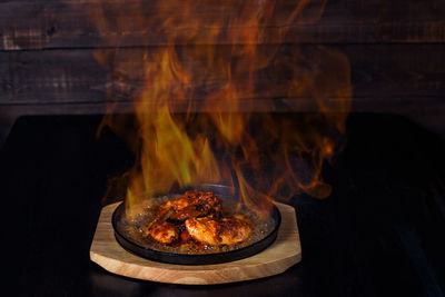 Close-up of meat on barbecue grill