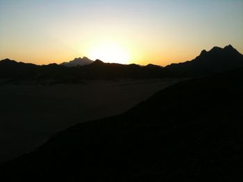 Scenic view of mountains at sunset