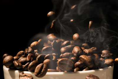 Close-up of coffee beans against black background
