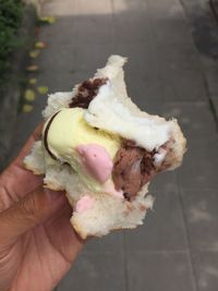 Midsection of person holding ice cream cone