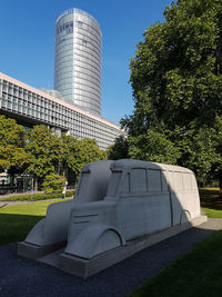 Low angle view of office building against blue sky