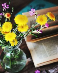 Close-up of yellow flowers on table