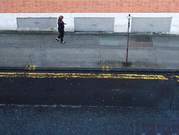 Full length of man walking on street