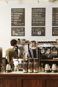 Colleagues working in cafe