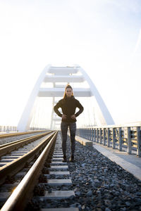 Full length of man standing on railroad track